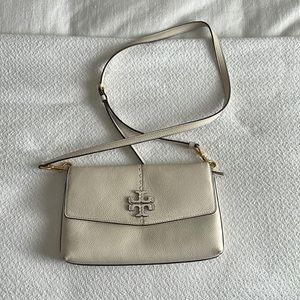 A wear with anything and everything cross body or clutch bag. Brand: Tory Burch